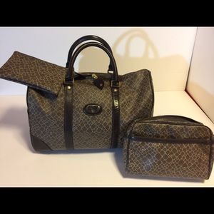 Pre owned authentic NINA RICCI TRAVELING BAG